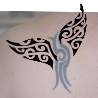 Whale tail tattoo