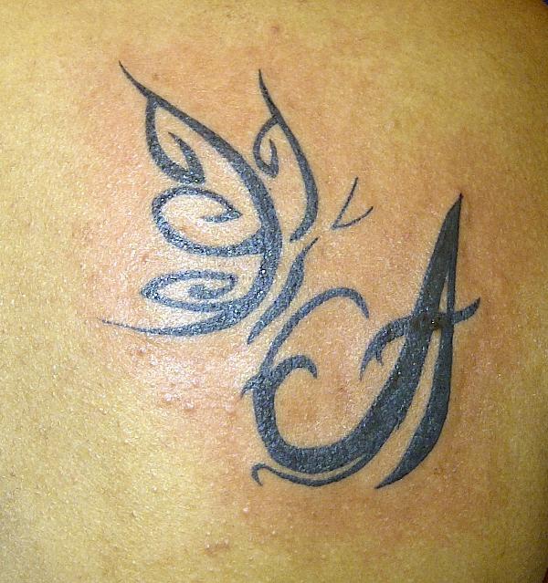 Akila - Butterfly on A tattoo photo