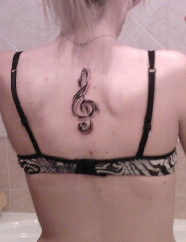 Alessandra - Tribal music tattoo photo