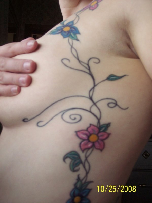 Cecilia - Vine of flowers tattoo photo