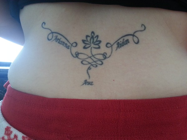 Dionne - lotus lowerback tattoo photo