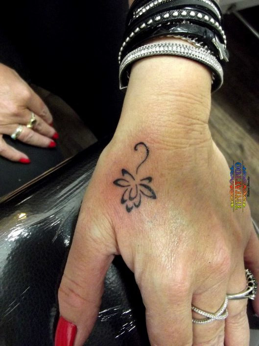 Guest - Lotus flower tattoo