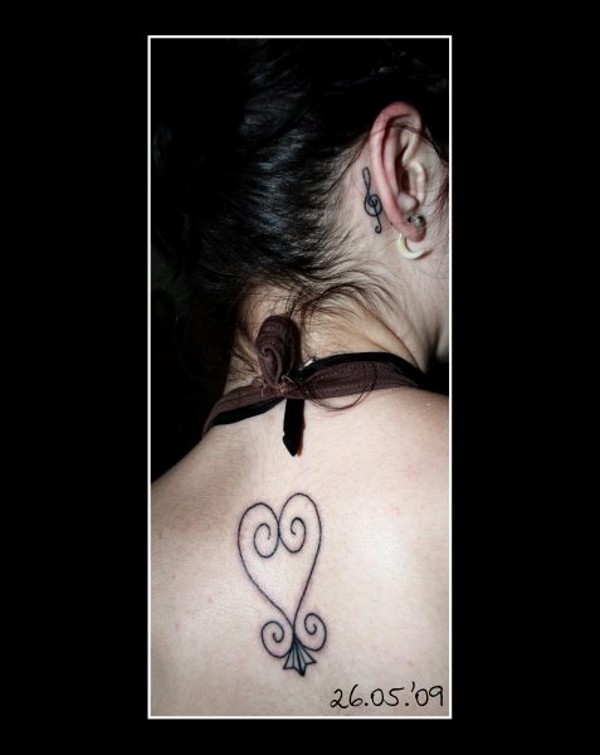 Kiki - Sankofa & treble clef tattoo photo