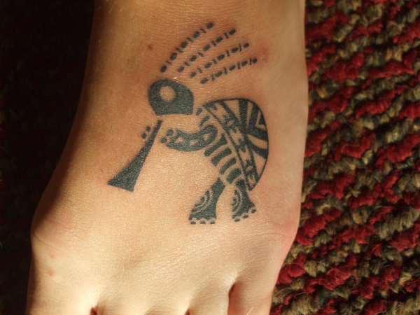 Kylie - kokopelli turtle tattoo photo