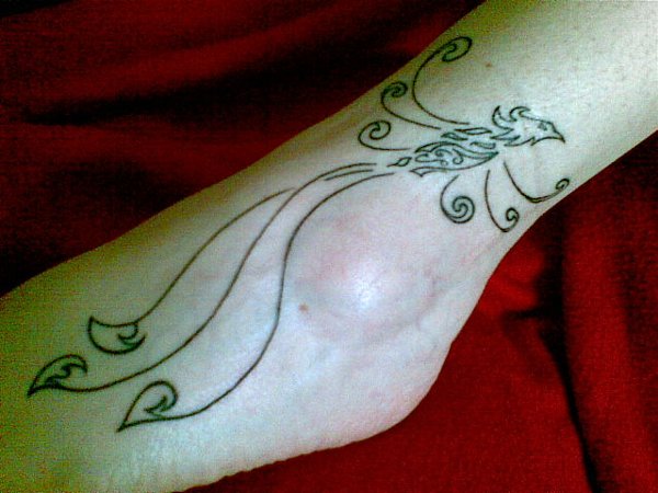 Luana - Phoenix with korus tattoo photo