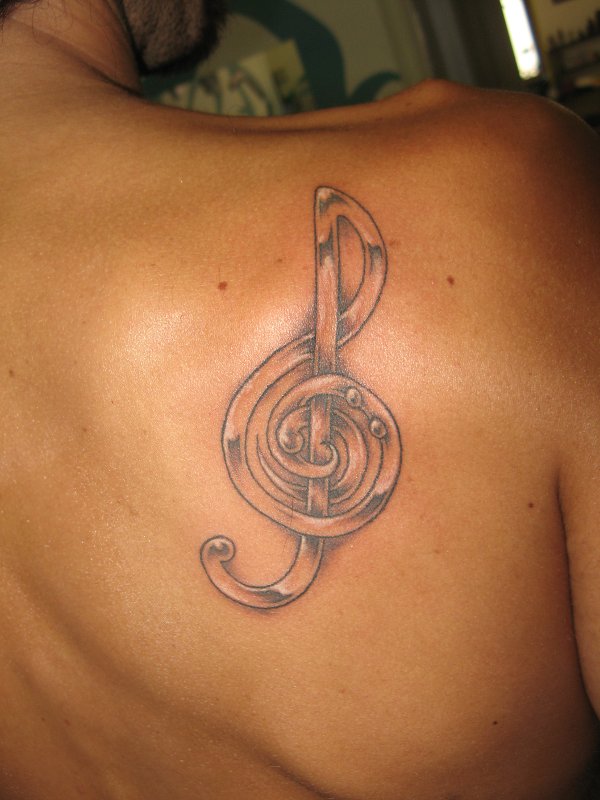 Nunzio - Musical clefs tattoo photo