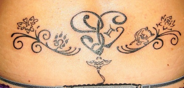 Sara - SL heart lowerback tattoo photo