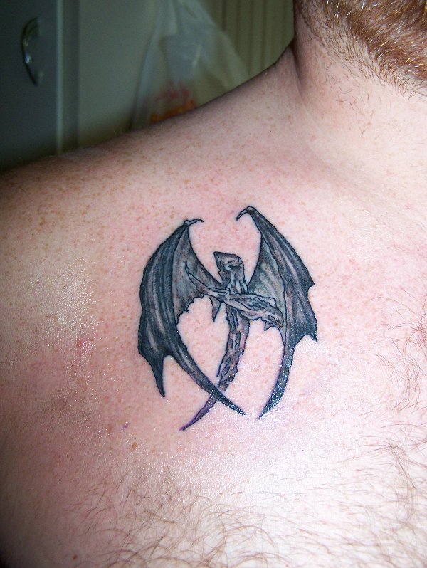 Shawn - Wooden winged cross tattoo