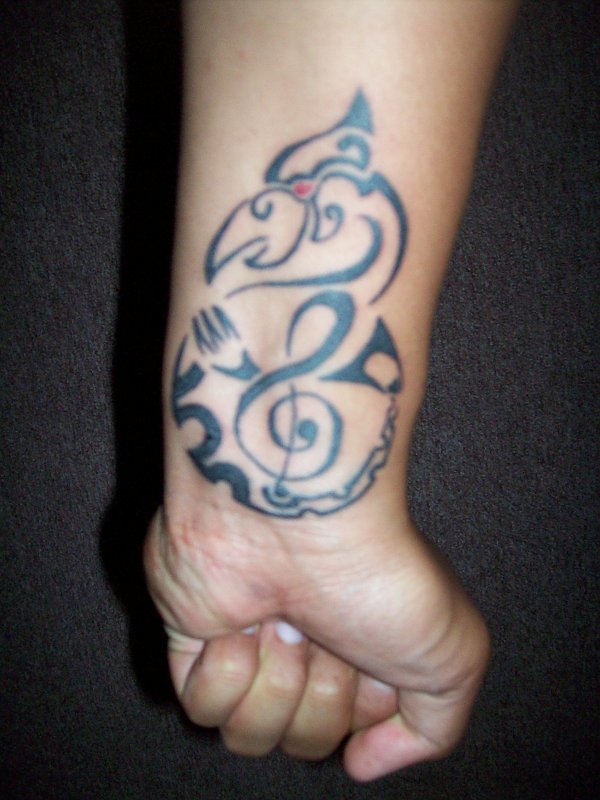 Souls - Manaia and treble clef tattoo photo
